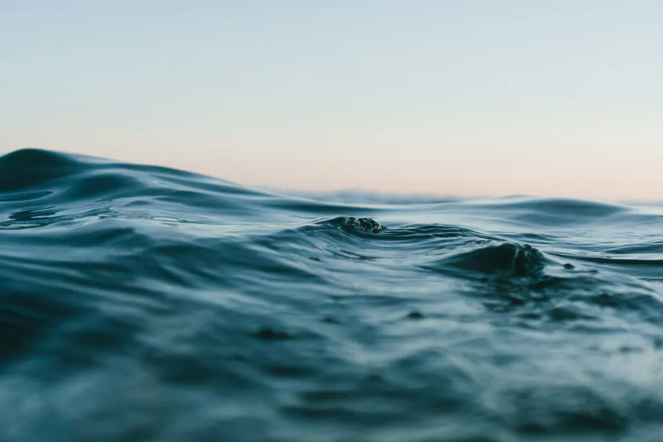 Open sea and distant horizon in soft coastal light