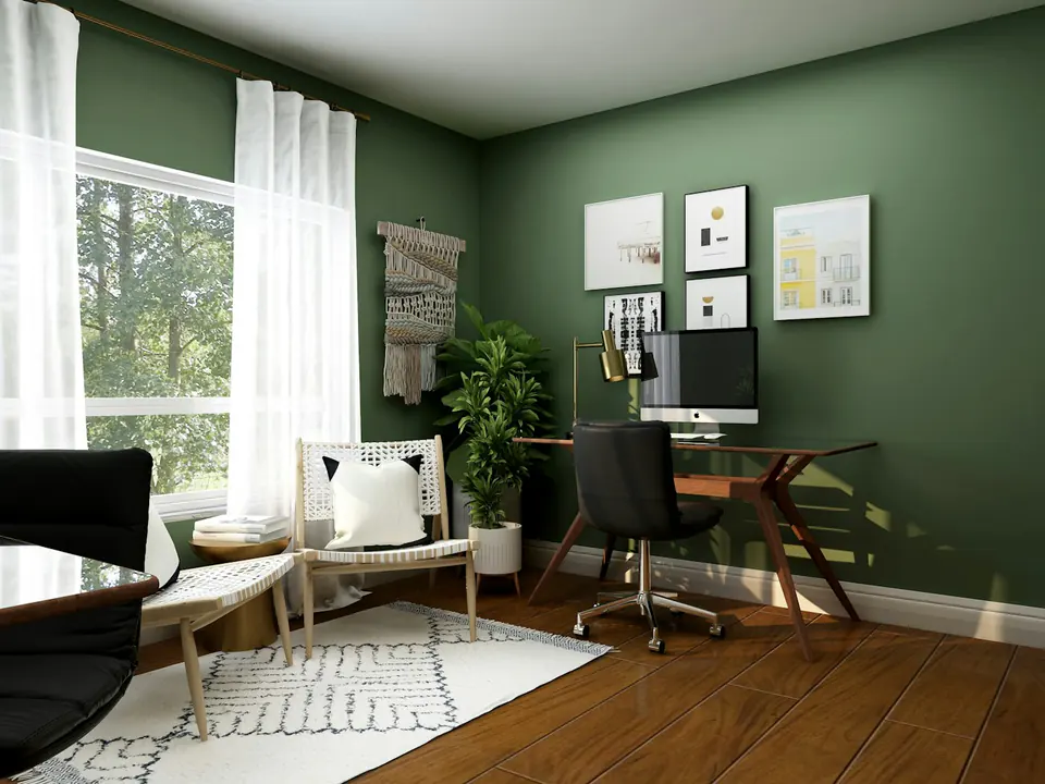 An intimate workspace with green walls and natural timber